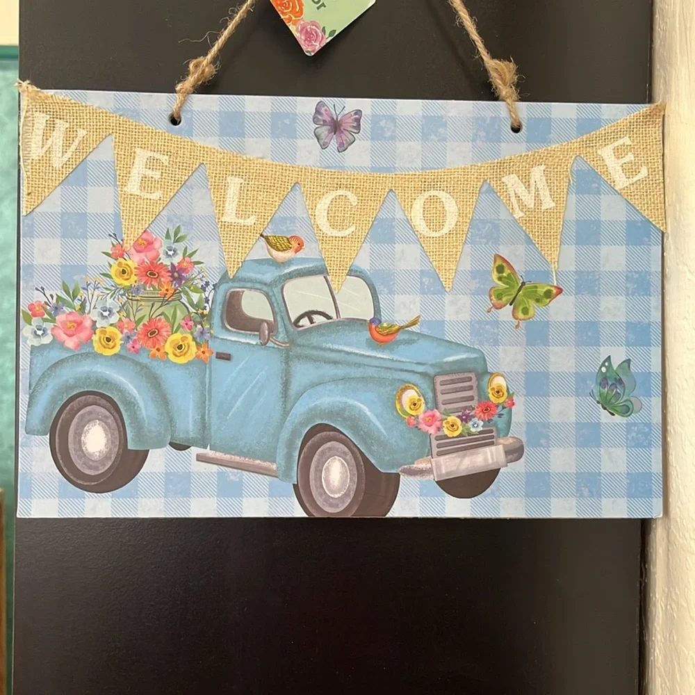 Blue Welcome Sign with Floral Truck Design